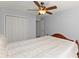 Cozy bedroom with a ceiling fan, closet and neutral paint at 6615 Grove Meadows Ln, Cumming, GA 30028