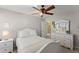 Bedroom with ceiling fan and white furniture at 6615 Grove Meadows Ln, Cumming, GA 30028