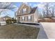 Beautiful two-story home with well-manicured landscaping at 6615 Grove Meadows Ln, Cumming, GA 30028