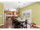 Eat-in kitchen features a dining table set for 6 and stainless appliances at 6615 Grove Meadows Ln, Cumming, GA 30028