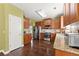 Well-equipped kitchen featuring stainless steel appliances and wood cabinetry at 6615 Grove Meadows Ln, Cumming, GA 30028