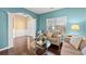 Cozy living room with hardwood floors, soft lighting, and neutral-toned furniture at 6615 Grove Meadows Ln, Cumming, GA 30028
