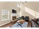 Bright living room featuring a fireplace and high ceilings for an airy feel at 6615 Grove Meadows Ln, Cumming, GA 30028
