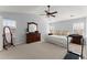 Serene main bedroom with ample space, carpeted floors, and natural light at 6615 Grove Meadows Ln, Cumming, GA 30028