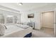 Bright bedroom with a large window, mirrored dresser, and access to a walk-in closet at 1566 Ridgebrook Downs, Mableton, GA 30126