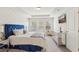Stylish bedroom featuring a blue headboard, mirrored nightstands, and recessed lighting at 1566 Ridgebrook Downs, Mableton, GA 30126