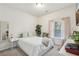 Bright bedroom with a queen bed, neutral decor and natural light from the window at 1566 Ridgebrook Downs, Mableton, GA 30126