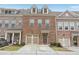 Charming brick townhome with a one-car garage and beautifully maintained front lawn at 1566 Ridgebrook Downs, Mableton, GA 30126