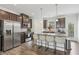 Spacious kitchen featuring stainless steel appliances, center island with chairs, and hardwood floors at 1566 Ridgebrook Downs, Mableton, GA 30126