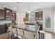 Modern kitchen with granite countertops, stainless steel appliances, and dark brown cabinetry at 1566 Ridgebrook Downs, Mableton, GA 30126