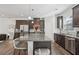 Well-lit kitchen with a large center island, stainless steel appliances and modern cabinetry at 1566 Ridgebrook Downs, Mableton, GA 30126