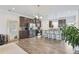 Modern kitchen with dark cabinets, stainless steel appliances, and a breakfast bar with seating at 1566 Ridgebrook Downs, Mableton, GA 30126