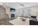 Open-concept living room with a fireplace, sleek flooring, and comfortable seating, perfect for relaxation at 1566 Ridgebrook Downs, Mableton, GA 30126