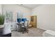 Bright home office with natural light, a modern desk setup, and ample space for productivity at 1566 Ridgebrook Downs, Mableton, GA 30126