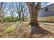 Expansive backyard featuring well-maintained lawn and mature trees, framed by a wooden fence at 1600 Temple Ave, Atlanta, GA 30337