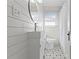 Modern bathroom with stylish vanity, unique floor tiles, and a shower at 1600 Temple Ave, Atlanta, GA 30337