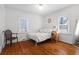 Cozy bedroom with hardwood floors, natural light, and a classic aesthetic at 1600 Temple Ave, Atlanta, GA 30337