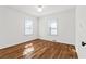 This bedroom features hardwood floors and natural light at 1600 Temple Ave, Atlanta, GA 30337