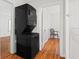 Conveniently located laundry area featuring a stacked washer and dryer unit at 1600 Temple Ave, Atlanta, GA 30337