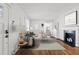 Bright living room with a decorative fireplace and hardwood floors at 1600 Temple Ave, Atlanta, GA 30337