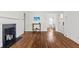 Open-concept living room features hardwood floors, a fireplace, and a view into the dining area at 1600 Temple Ave, Atlanta, GA 30337