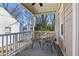 Cozy front porch with neutral furniture and a graphic rug, perfect for relaxing outdoors at 1600 Temple Ave, Atlanta, GA 30337
