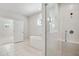 Modern bathroom featuring a luxurious soaking tub and glass-enclosed shower with tile surround at 1891 Audubon Park Ln, Decatur, GA 30033