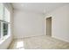 A bright bedroom features recessed lights, a large window, and neutral carpeting at 1891 Audubon Park Ln, Decatur, GA 30033