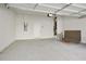 Spacious garage with concrete floors, white walls, overhead lighting, and storage space potential at 1891 Audubon Park Ln, Decatur, GA 30033