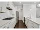 Contemporary kitchen with white cabinets, stainless steel appliances, and quartz countertops at 1891 Audubon Park Ln, Decatur, GA 30033