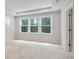 A large main bedroom offers abundant natural light from multiple windows and recessed lighting at 1891 Audubon Park Ln, Decatur, GA 30033