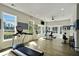 Well-lit workout room with large windows, exercise equipment, and hardwood floors at 1891 Audubon Park Ln, Decatur, GA 30033
