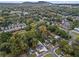 Aerial view of a charming neighborhood surrounded by mature trees, close to city amenities at 253 Mcintosh Avenue Ne, Marietta, GA 30060