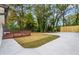 Large backyard with a stained wood deck, concrete patio, and a new wooden fence at 253 Mcintosh Avenue Ne, Marietta, GA 30060