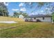 Spacious backyard with new sod, concrete patio, wood fence, and charming home exterior at 253 Mcintosh Avenue Ne, Marietta, GA 30060