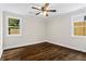 Large bedroom featuring hardwood floors and two large windows at 253 Mcintosh Avenue Ne, Marietta, GA 30060