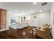 Open floorplan from living room to kitchen, featuring exposed brick and lots of seating at 253 Mcintosh Avenue Ne, Marietta, GA 30060