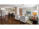 Spacious living room featuring an open floor plan, hardwood floors, and a sliding barn door at 253 Mcintosh Avenue Ne, Marietta, GA 30060