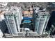 Aerial view of two high rise condos surrounding a pool and courtyard at 923 Peachtree Ne St # 932, Atlanta, GA 30309