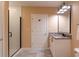 Bathroom with a subway-tiled walk-in shower, granite countertop, and neutral paint at 923 Peachtree Ne St # 932, Atlanta, GA 30309