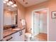 Bathroom featuring granite countertops, white cabinets, and neutral paint at 923 Peachtree Ne St # 932, Atlanta, GA 30309