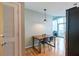 A small dining area featuring an eating table next to a modern living room at 923 Peachtree Ne St # 932, Atlanta, GA 30309