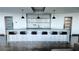 Community kitchen with bar seating, and stainless steel sink at 923 Peachtree Ne St # 932, Atlanta, GA 30309