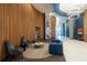 Modern lobby with stylish seating, wood paneling, and decorative lighting at 923 Peachtree Ne St # 932, Atlanta, GA 30309