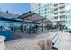 Beautiful condominium patio area with outdoor seating and a grilling station at 923 Peachtree Ne St # 932, Atlanta, GA 30309