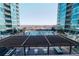 Relax on the patio and enjoy the view of the shimmering community swimming pool at 923 Peachtree Ne St # 932, Atlanta, GA 30309