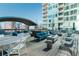 Enjoy the rooftop patio featuring comfortable seating around a modern fire pit at 923 Peachtree Ne St # 932, Atlanta, GA 30309