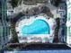 Aerial view of condominium community outdoor pool and common areas with lounge seating at 923 Peachtree Ne St # 932, Atlanta, GA 30309