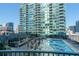 Resort style outdoor pool surrounded by seating and lounge chairs at 923 Peachtree Ne St # 932, Atlanta, GA 30309