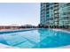 Condo community pool with lounge chairs and shade overlooking the building at 923 Peachtree Ne St # 932, Atlanta, GA 30309